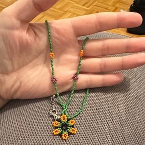 Green Beaded Necklace with Floral Pendant